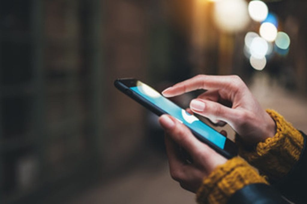 Person using Smartphone with Touchscreen