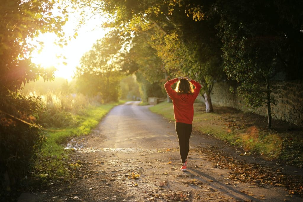 Women walking in a park at sunrise