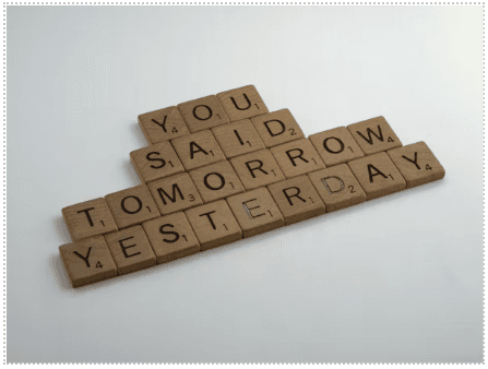 scrabble tiles spelling out you said tomorrow yesterday